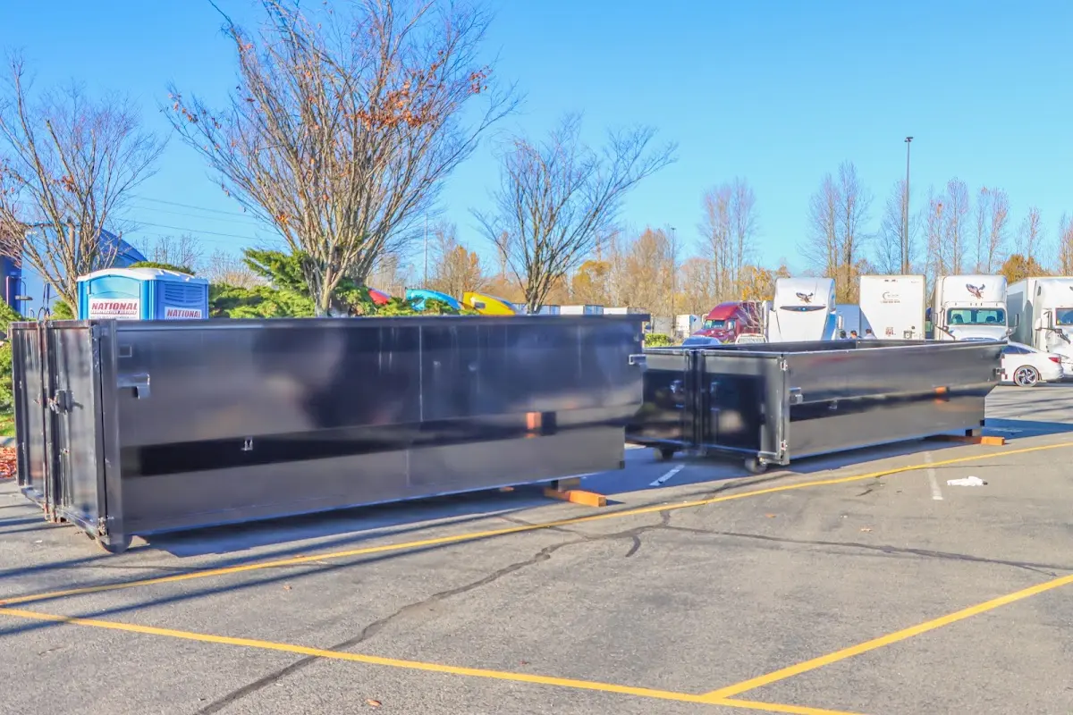 Professional dumpster rental service with roll-off container on residential driveway in Simi Valley